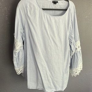 Beautiful blue and white pinstripe top with lace bell sleeves.